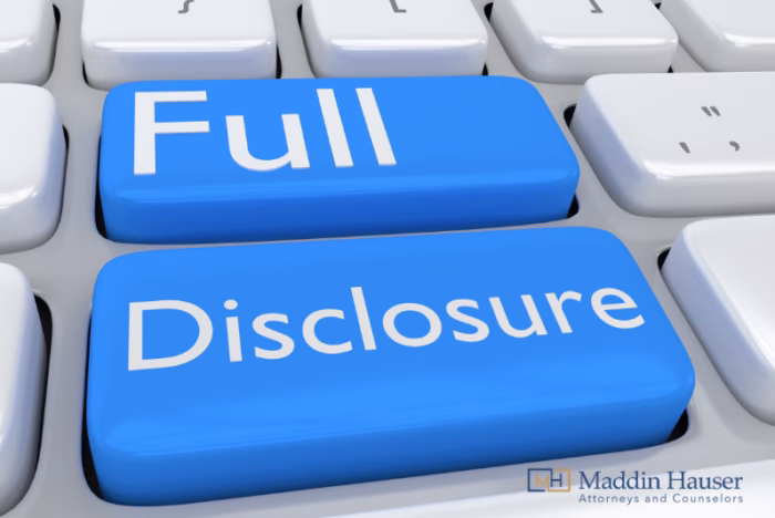 The words full disclosure on a keyboard